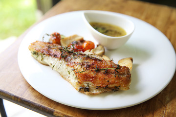 Sea bass fillet on wood background