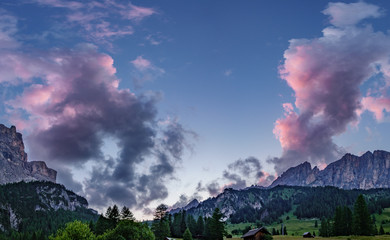 Pink clouds over dolomite mountains