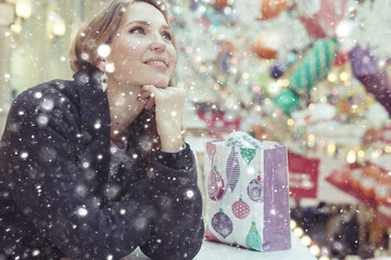 buying Christmas gifts girl snow outside the bag