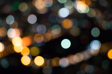 Colorful bokeh circles for background, Glitter of city night light on dark background, Festive Christmas party abstract background.