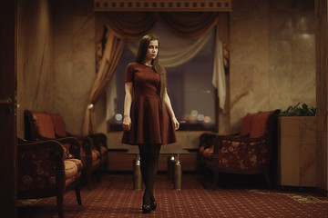 lonely sad woman in the hotel interior