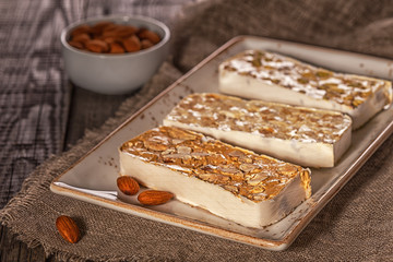 Nougat with honey and nuts, selective focus.