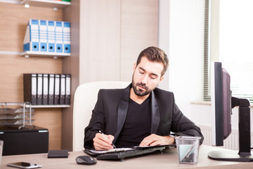 Naklejka premium Businessman working at his office. Businessperson in professional environment
