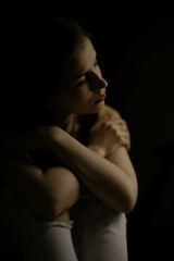 Studio portrait of a beautiful brunette on a black background