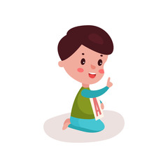 Cute little boy sitting on the floor playing with letter A, kid learning through fun and play colorful cartoon vector Illustration