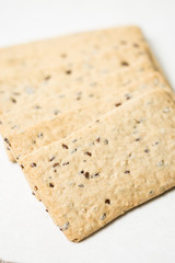 Flax chips isolated above white marble background table