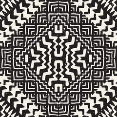 Black and white tribal vector seamless pattern with doodle elements. Aztec abstract art print. Ethnic ornamental hand drawn backdrop.