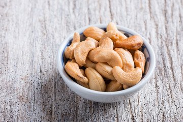 Roasted cashew nuts on rustic wood