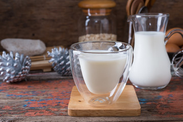Milk cup on wooden on wooden background