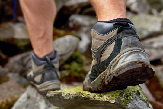 Hiking Man With Trekking Boots On The Trail