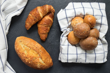 Homemade cakes from wheat flour, grain bread, croissants