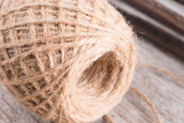 Hemp rope on wood background