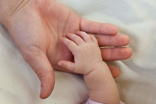 Father's and baby's hands