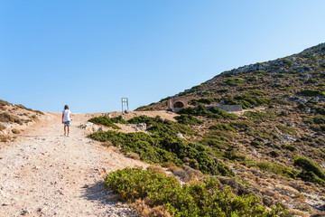 Girl on a mountain path. Akrotiri peninsula, Crete, Greece