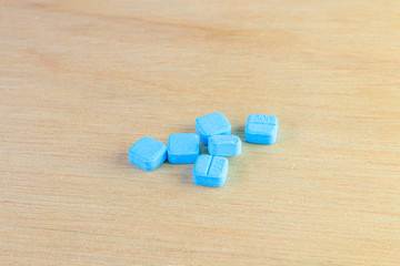 pills blue On wooden floor with copy space add text  ( high definition image )