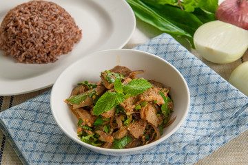 Nam Tok or Spicy Grilled Beef Salad Served with Lettuce Leaves