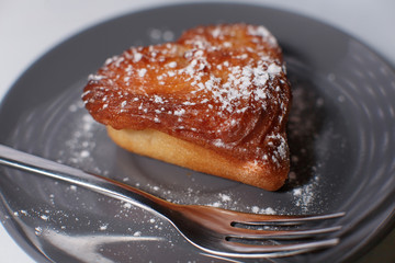 fruit cupcake on a saucer and fork
