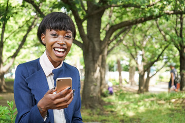 african woman using a smartphone