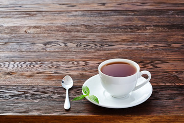 Hot earl grey tea with lemon slice top view on wood table