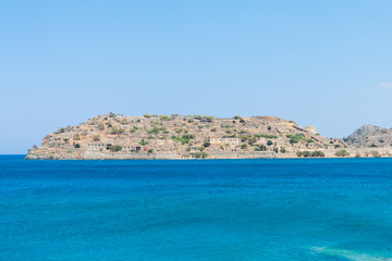 Fototapeta premium View of the island of&nbsp;Spinalonga (Kalydon) with the abandoned leper colony and the Venetian fortress from the sea