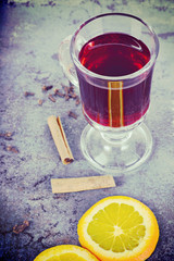 Red mulled wine with spices, retro toned