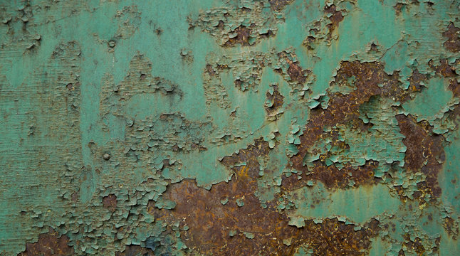 Old paint peeling on a rusty metal - Powered by Adobe