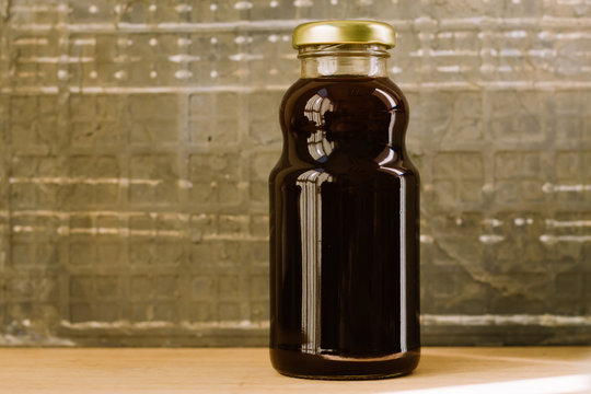 Raw Kelulut honey bee in a jar ove the wooden table