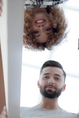 Close-up view of husband and wife looking inside the box.