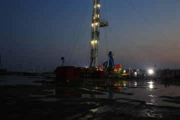 Oil drilling platform in the beautiful night