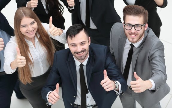 successful business team holding up a thumbs up