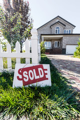 house with sign sold