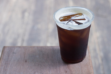 Sparkling Nitro Cold Brew Coffee in plastic glass ready to drink