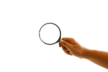 Male hand holding a magnify glass isolated on white background, clipping path.
