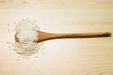 wooden spoon with rice