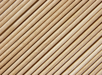 Wooden toothpicks are laid out in a number of