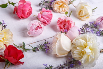 Festive flower composition on the white wooden background. Overhead view