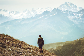Man hiking at mountains landscape Travel Lifestyle wanderlust adventure concept summer vacations...
