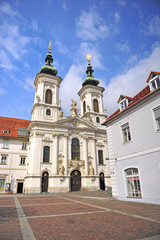 Fototapeta na wymiar Baroque church in the street of Graz