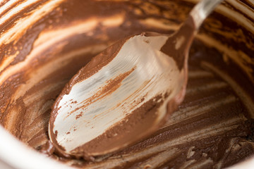 Empty chocolate cream pot with spoon closeup macro
