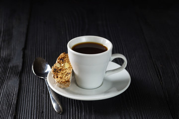 Cup of black coffee with cantuccini