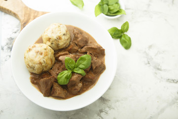 Traditional homemad beef goulash with dumplings