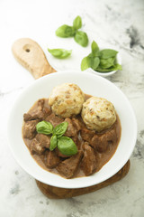 Traditional homemad beef goulash with dumplings