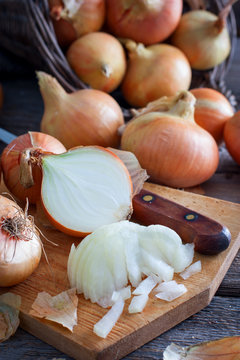 Finely chopped onions on a wooden table, selective focus