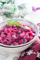 Christmas salad with beets and herring, selective focus