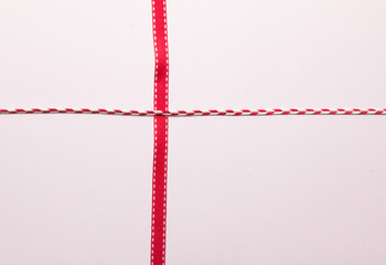 Red ribbon on paper background