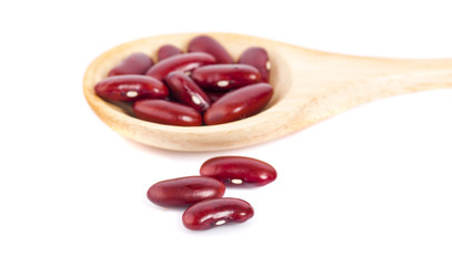 Red beans in wooden spoon isolated on white background