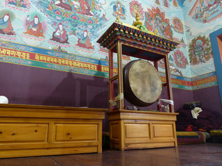 Big drum and beautiful colorful walls of Buddhist temple in Upper Pisang, Nepal, Annapurna Circuit...