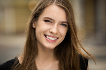 Fototapeta premium Young beautiful smiling girl. Natural beauty, woman with perfect smile.