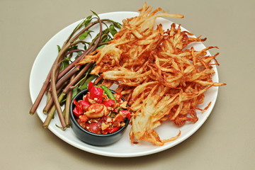 Thai popular recipe, SSpicy and sour mixed vegetable salad with fried crispy papaya roll .
