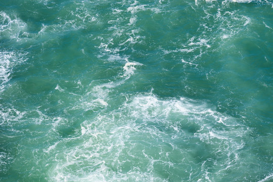 Fototapeta Wavy emerald ocean surface from above